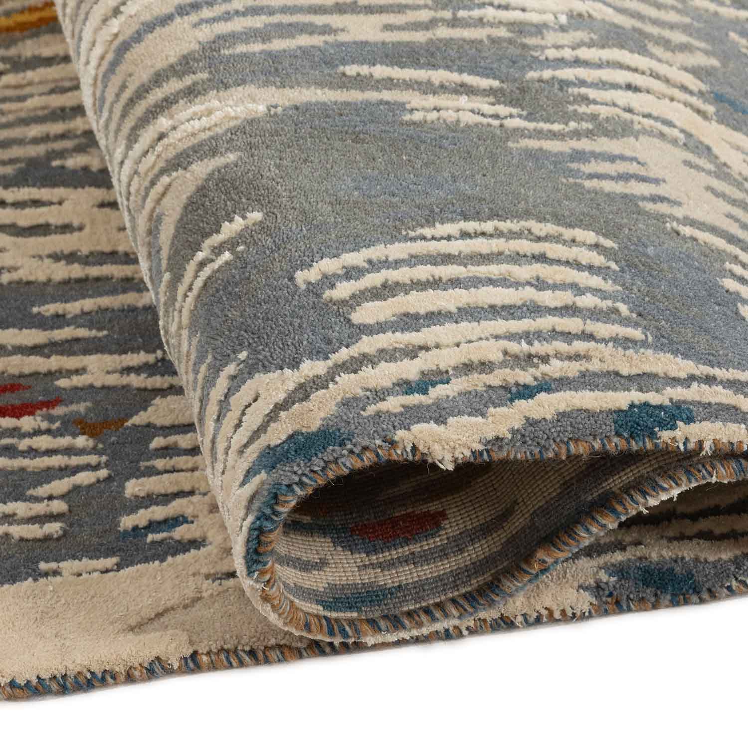 Alara hand knotted wool and silk rug by Angeli Sowani for Obeetee - angle view
